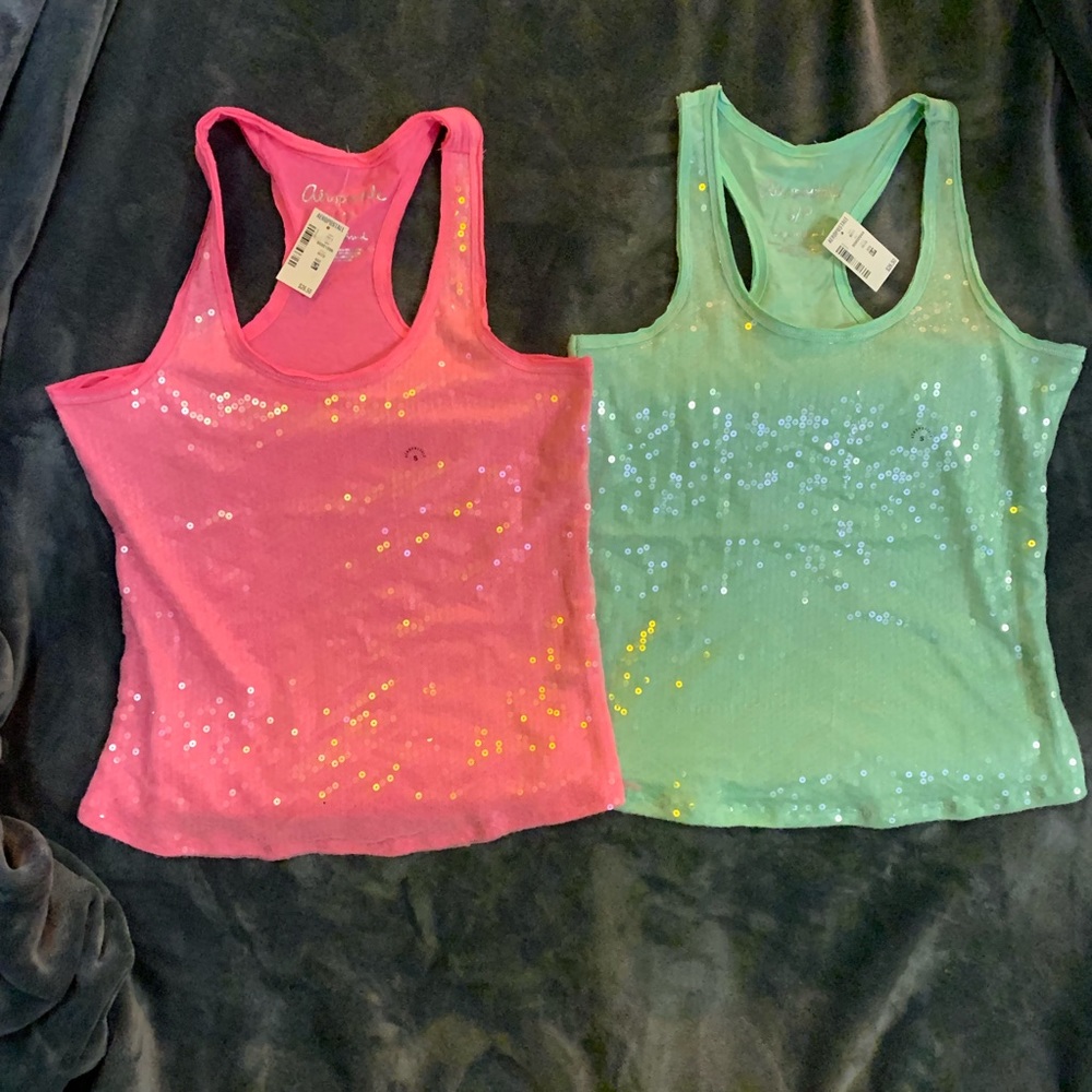 Pink and teal tanks.